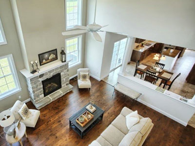 custom home living room with stone fireplace