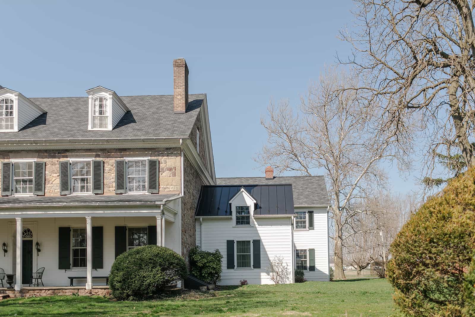 Historic stone house exterior evaluated to build up or build out